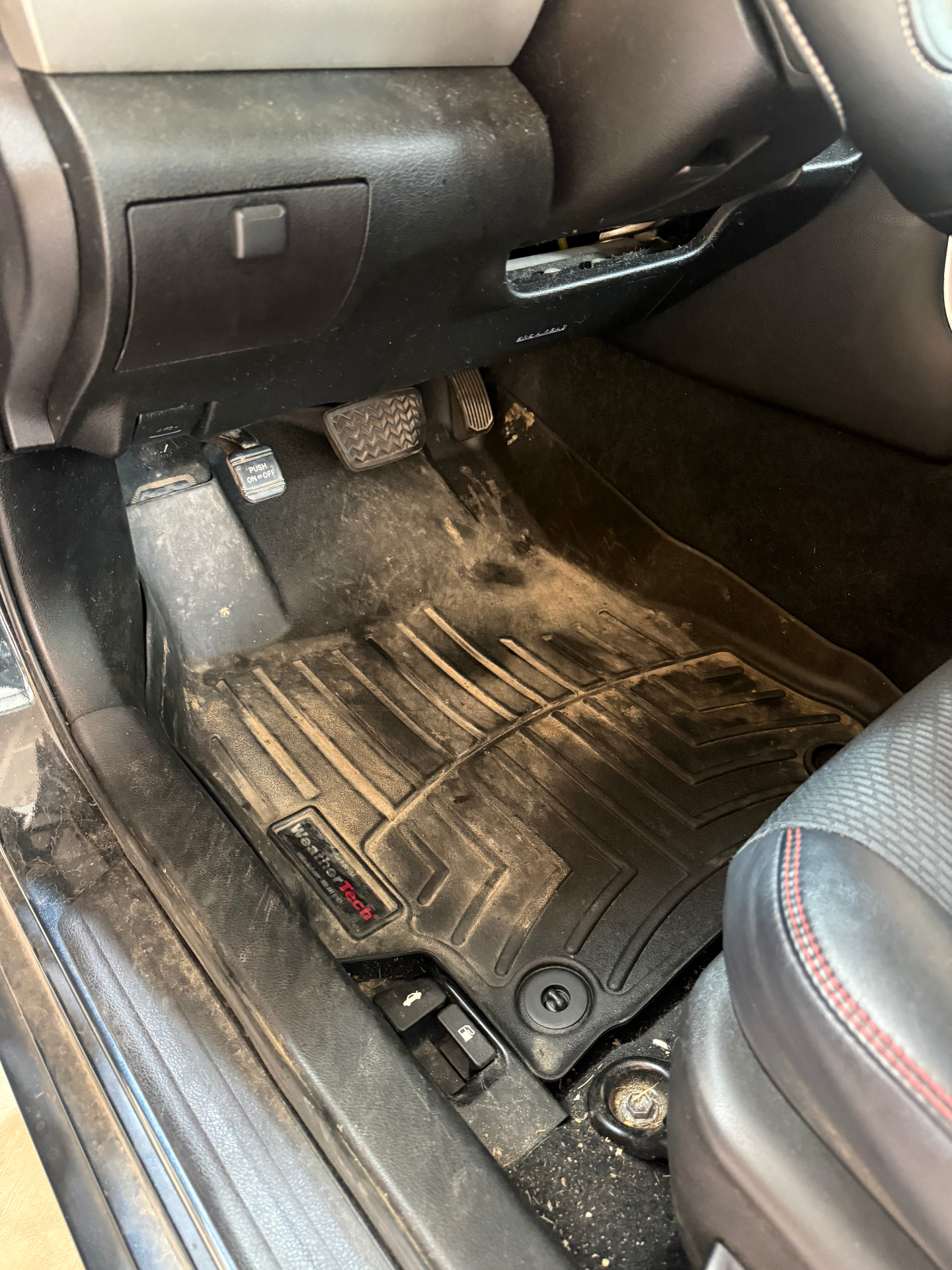 Toyota Camry driver footwell before cleaning